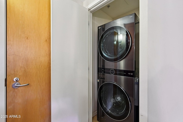 washroom featuring laundry area and stacked washer / drying machine