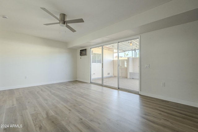 unfurnished room featuring hardwood / wood-style flooring and ceiling fan