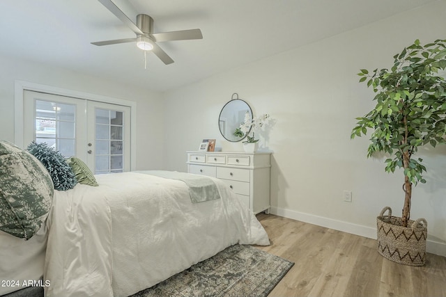 bedroom with french doors, access to outside, light hardwood / wood-style flooring, and ceiling fan