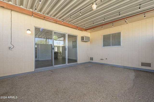 view of patio with a wall mounted AC