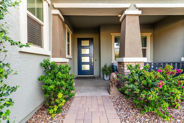 property entrance with stucco siding