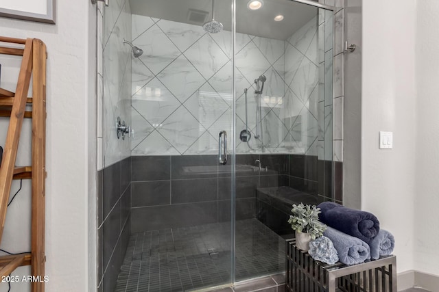 bathroom with a shower stall