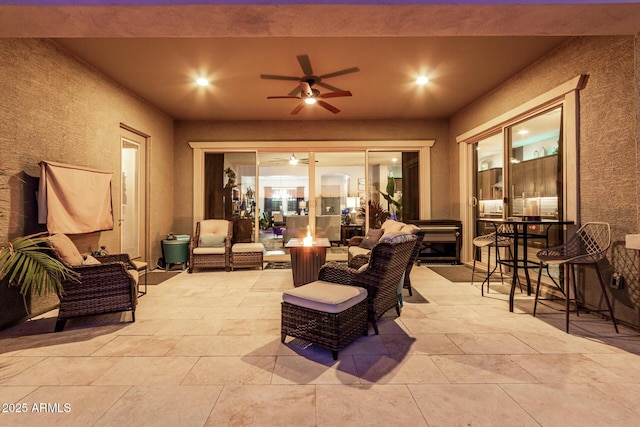 view of patio / terrace featuring an outdoor living space and ceiling fan