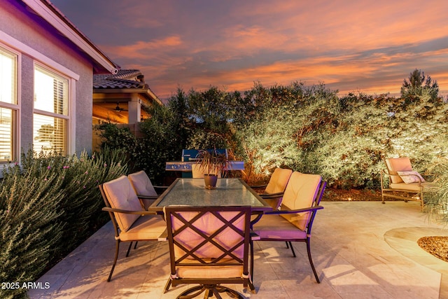 view of patio featuring ceiling fan and outdoor dining space