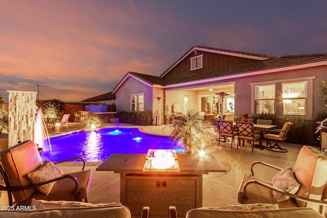 pool featuring outdoor dining space and a patio