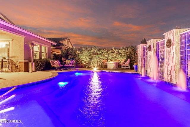 view of pool featuring a patio
