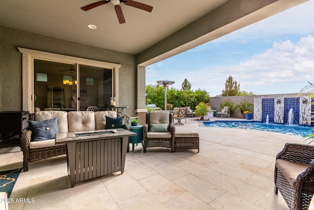 view of patio / terrace with a fenced in pool, an outdoor living space with a fire pit, fence, and a ceiling fan