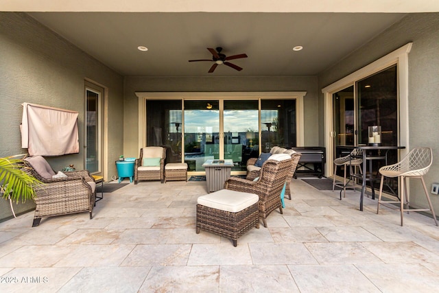 view of patio featuring an outdoor hangout area and a ceiling fan