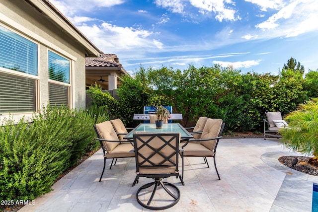 view of patio with grilling area and outdoor dining area