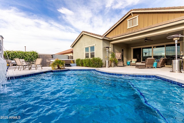 view of pool featuring outdoor lounge area, ceiling fan, a patio, and a fenced in pool