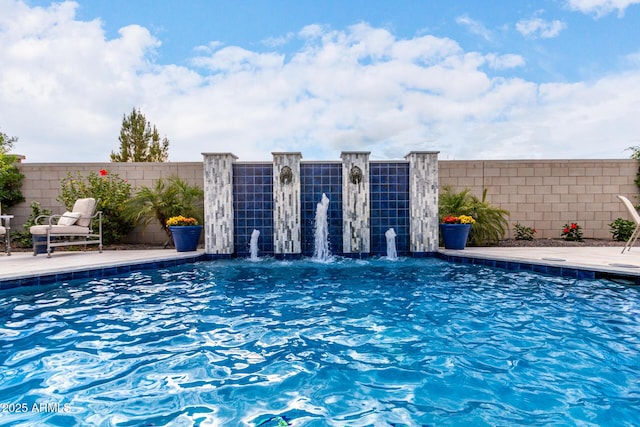 view of swimming pool with a fenced backyard and a fenced in pool