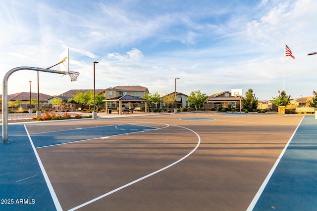 view of basketball court with a residential view, a gazebo, and community basketball court