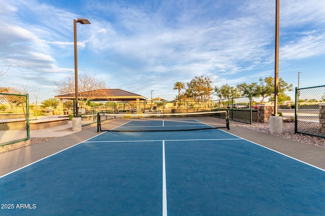 view of sport court featuring fence and community basketball court
