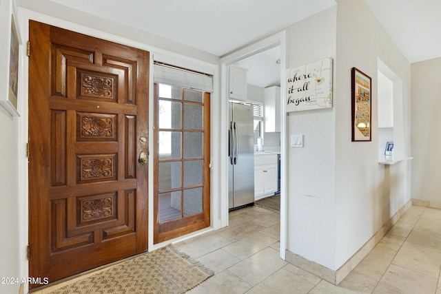 entryway with light tile flooring