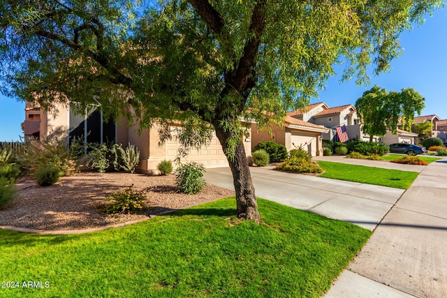 mediterranean / spanish house featuring a front yard