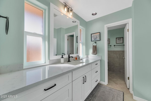 bathroom with vanity and tile patterned flooring