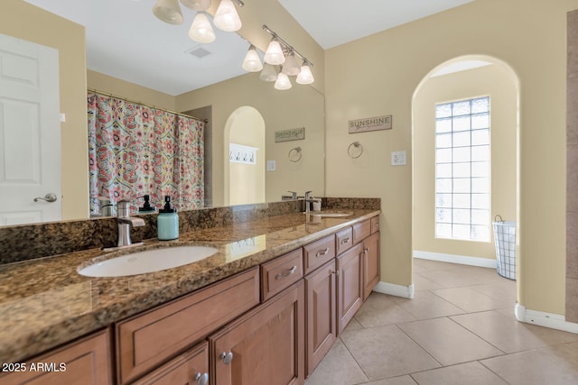 bathroom with tile patterned flooring and vanity