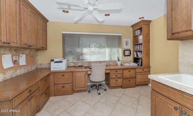 office space with ceiling fan and light tile patterned floors