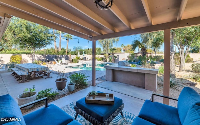 view of patio / terrace with a fenced in pool