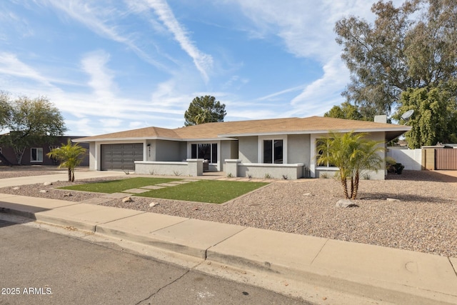 ranch-style house featuring a garage