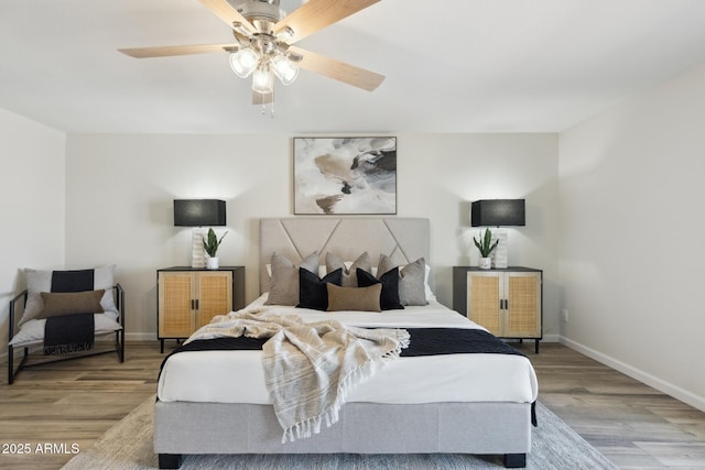 bedroom featuring ceiling fan and light hardwood / wood-style floors