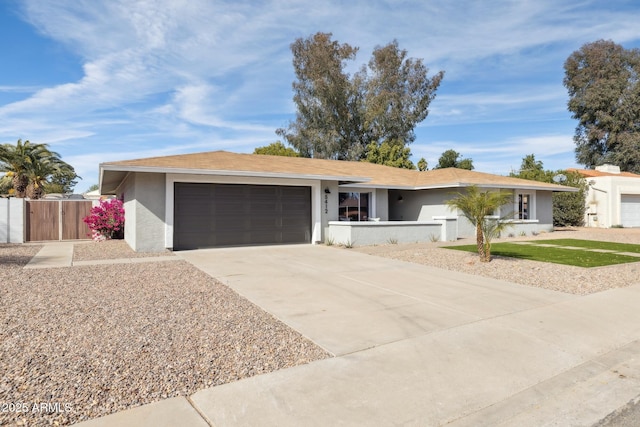 ranch-style home featuring a garage