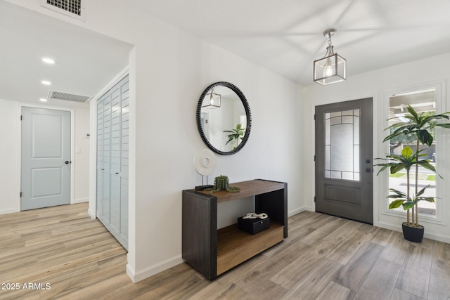 foyer entrance featuring light wood-type flooring