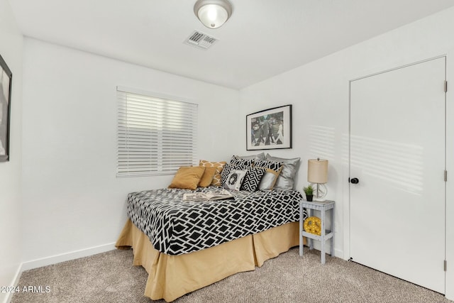 bedroom featuring carpet