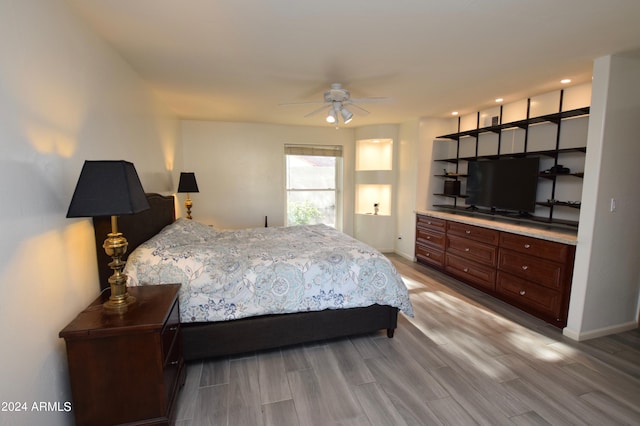 bedroom with hardwood / wood-style flooring and ceiling fan