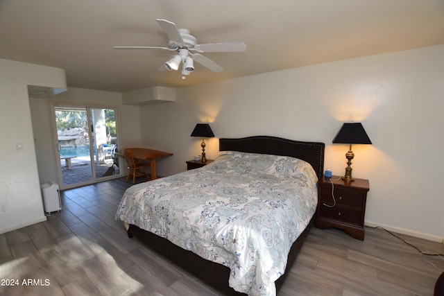 bedroom featuring wood-type flooring, ceiling fan, and access to exterior