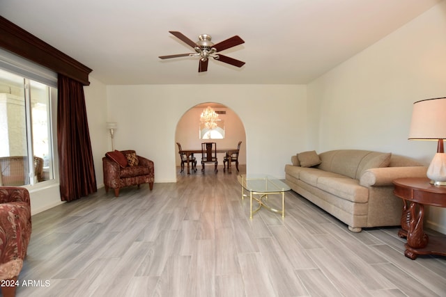 living room featuring light wood-type flooring and ceiling fan