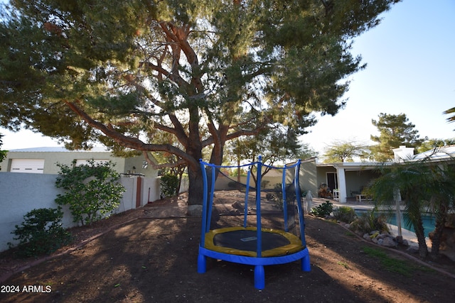 view of yard featuring a trampoline