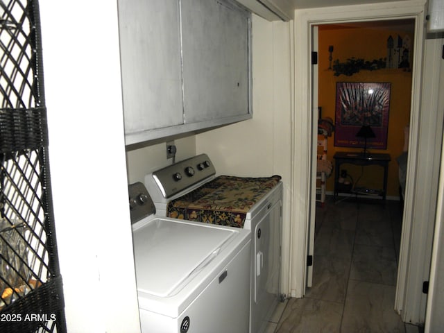 washroom featuring washer and clothes dryer