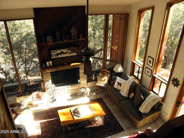 living room featuring a fireplace and tile patterned flooring