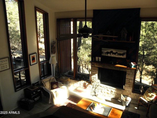 living room with plenty of natural light and a fireplace