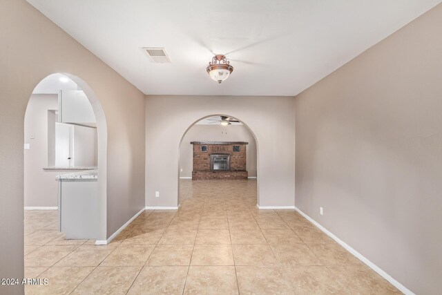 hallway featuring light tile patterned floors