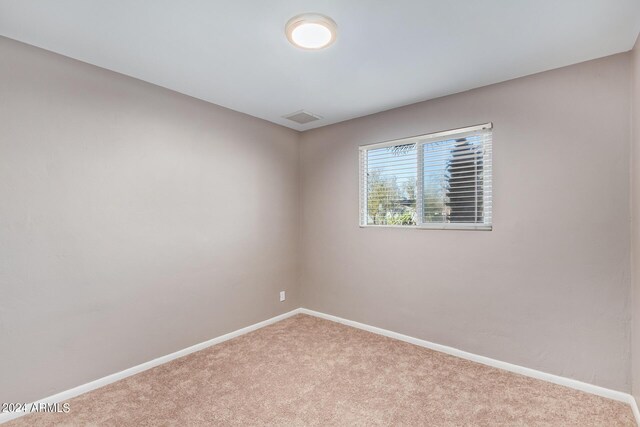 unfurnished room featuring carpet flooring