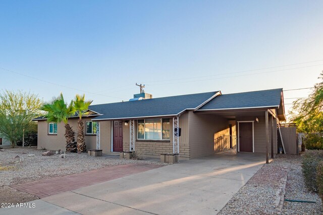 single story home with a carport