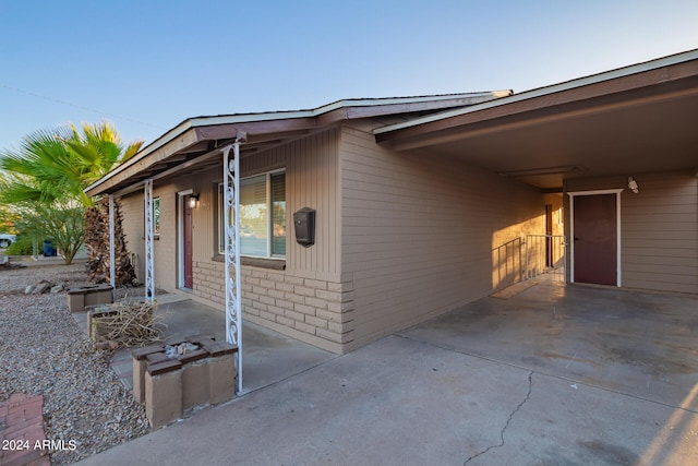 view of side of property with a patio