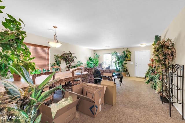 living room featuring light colored carpet and visible vents