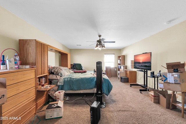 bedroom featuring ceiling fan and carpet floors