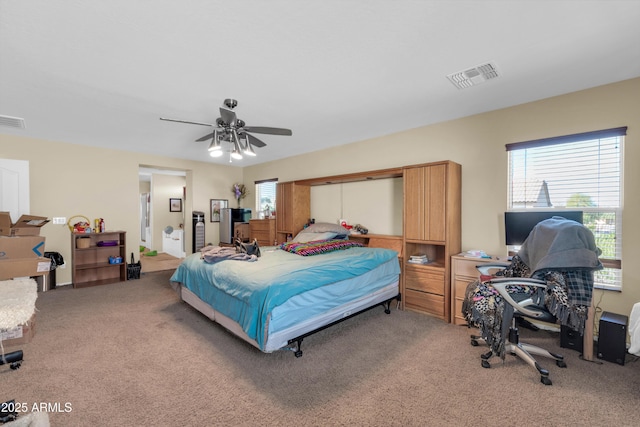 bedroom featuring visible vents, light carpet, and ceiling fan