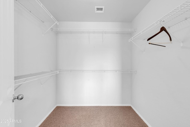 walk in closet with carpet flooring and visible vents