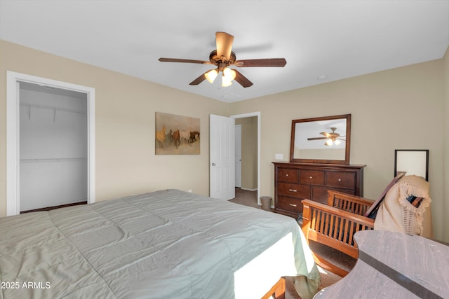 bedroom with a closet, a ceiling fan, and carpet floors