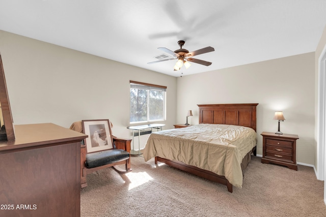 bedroom featuring light carpet and ceiling fan