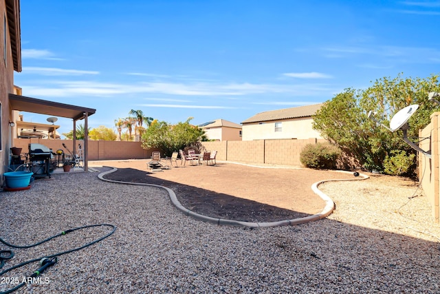 view of yard featuring a patio and a fenced backyard