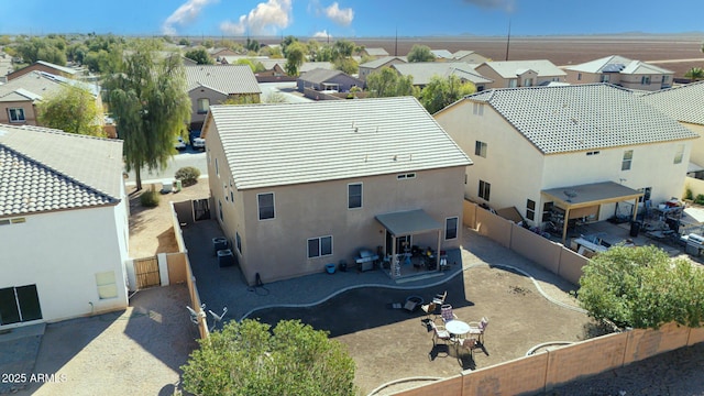 birds eye view of property with a residential view