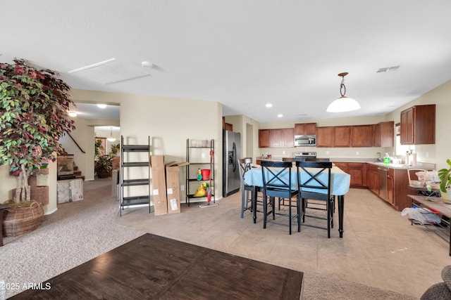 dining space featuring stairs, light tile patterned floors, recessed lighting, and visible vents