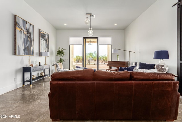 23008 E Galveston St, Mesa, AZ 85212 - living room featuring baseboards, concrete flooring, and recessed lighting