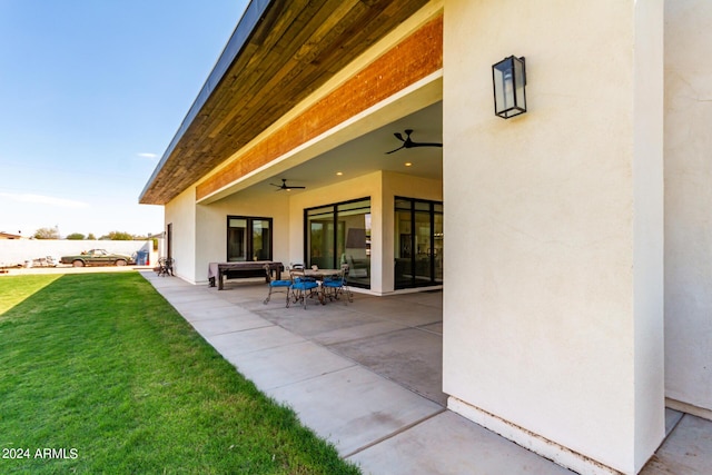 23008 E Galveston St, Mesa, AZ 85212 - rear view of house featuring ceiling fan, stucco siding, a patio, and a yard